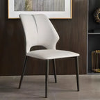 Chaise de salle à manger moderne sans accoudoirs, dossier ouvert, en similicuir.