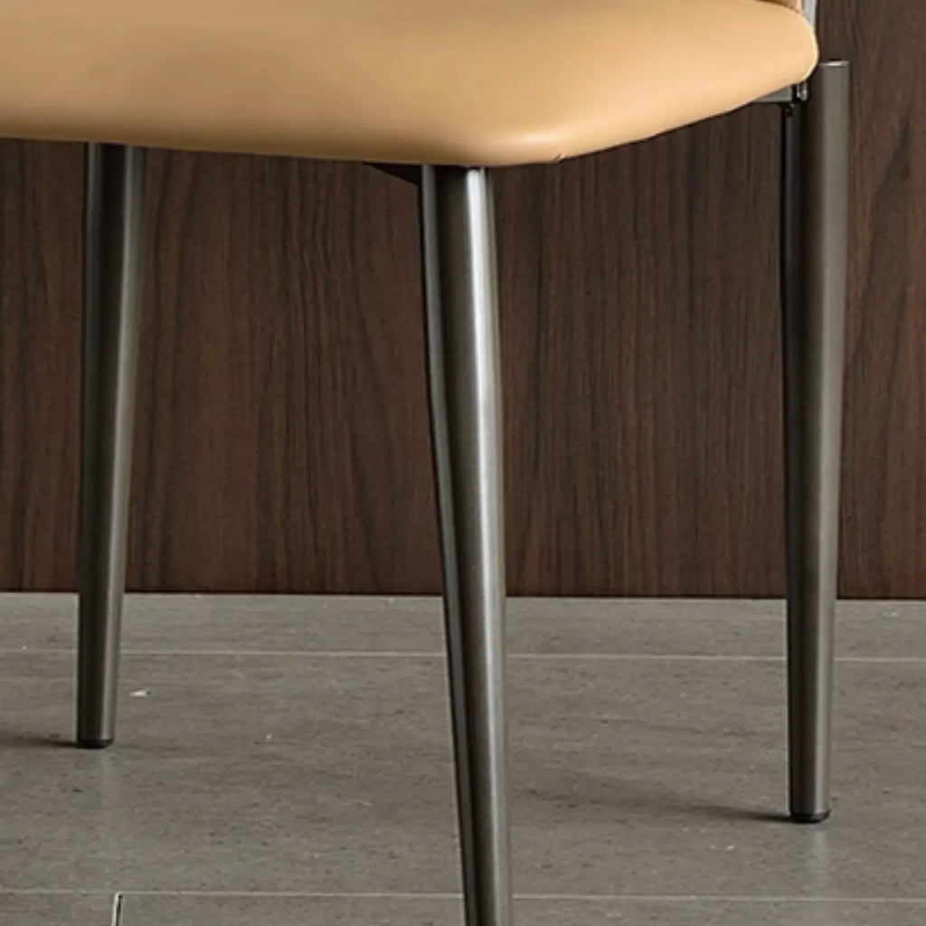 Chaise de salle à manger moderne sans accoudoirs, dossier ouvert, en similicuir.