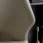 Chaise de salle à manger moderne sans accoudoirs, dossier ouvert, en similicuir.