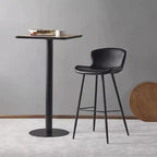 Tabouret de bar à dossier bas et assise en cuir marron