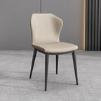 Chaise de salle à manger moderne en similicuir avec dossier à oreilles et pieds en acier