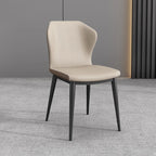 Chaise de salle à manger moderne en similicuir avec dossier à oreilles et pieds en acier