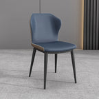 Chaise de salle à manger moderne en similicuir avec dossier à oreilles et pieds en acier