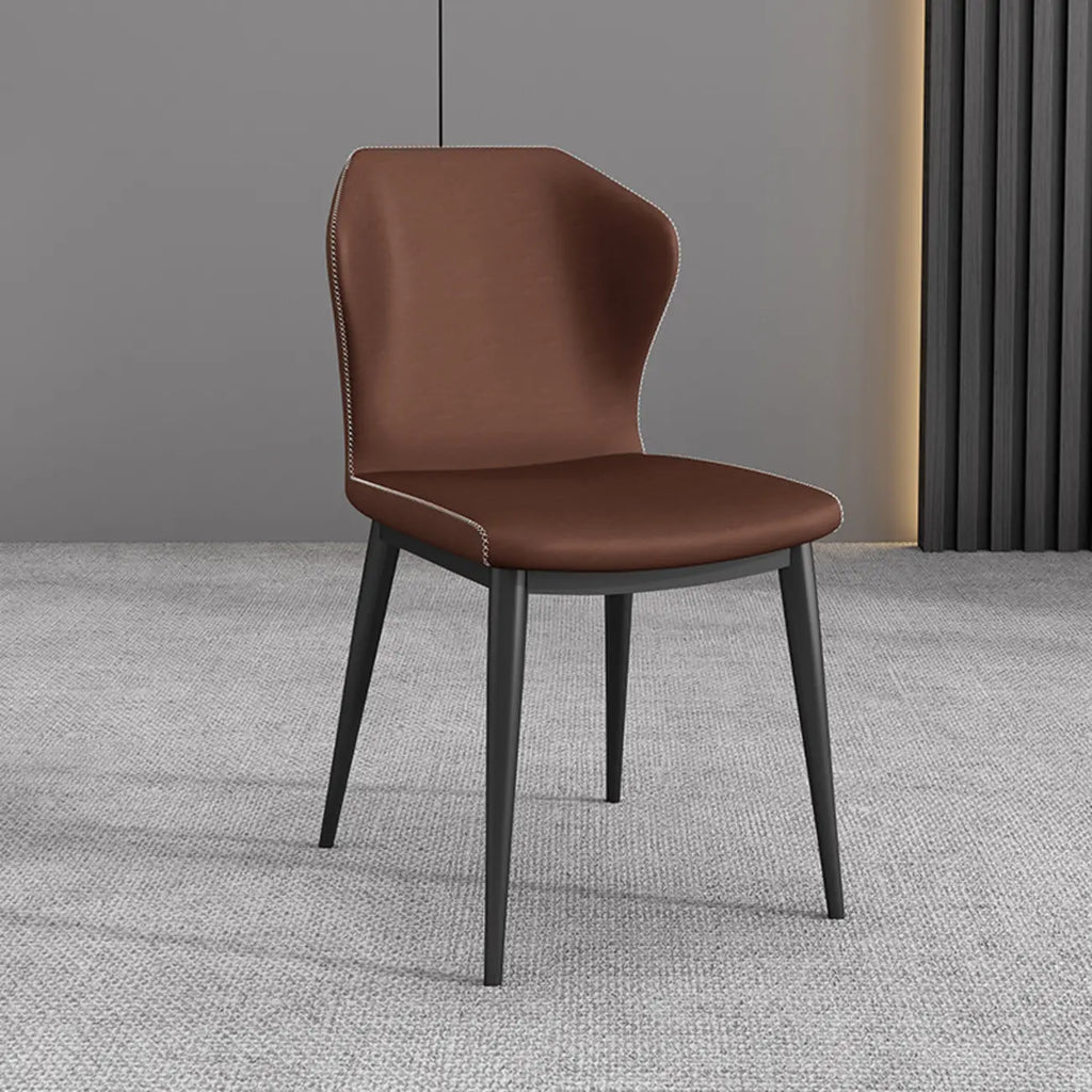 Chaise de salle à manger moderne en similicuir avec dossier à oreilles et pieds en acier