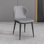 Chaise de salle à manger moderne en similicuir avec dossier à oreilles et pieds en acier