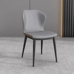 Chaise de salle à manger moderne en similicuir avec dossier à oreilles et pieds en acier