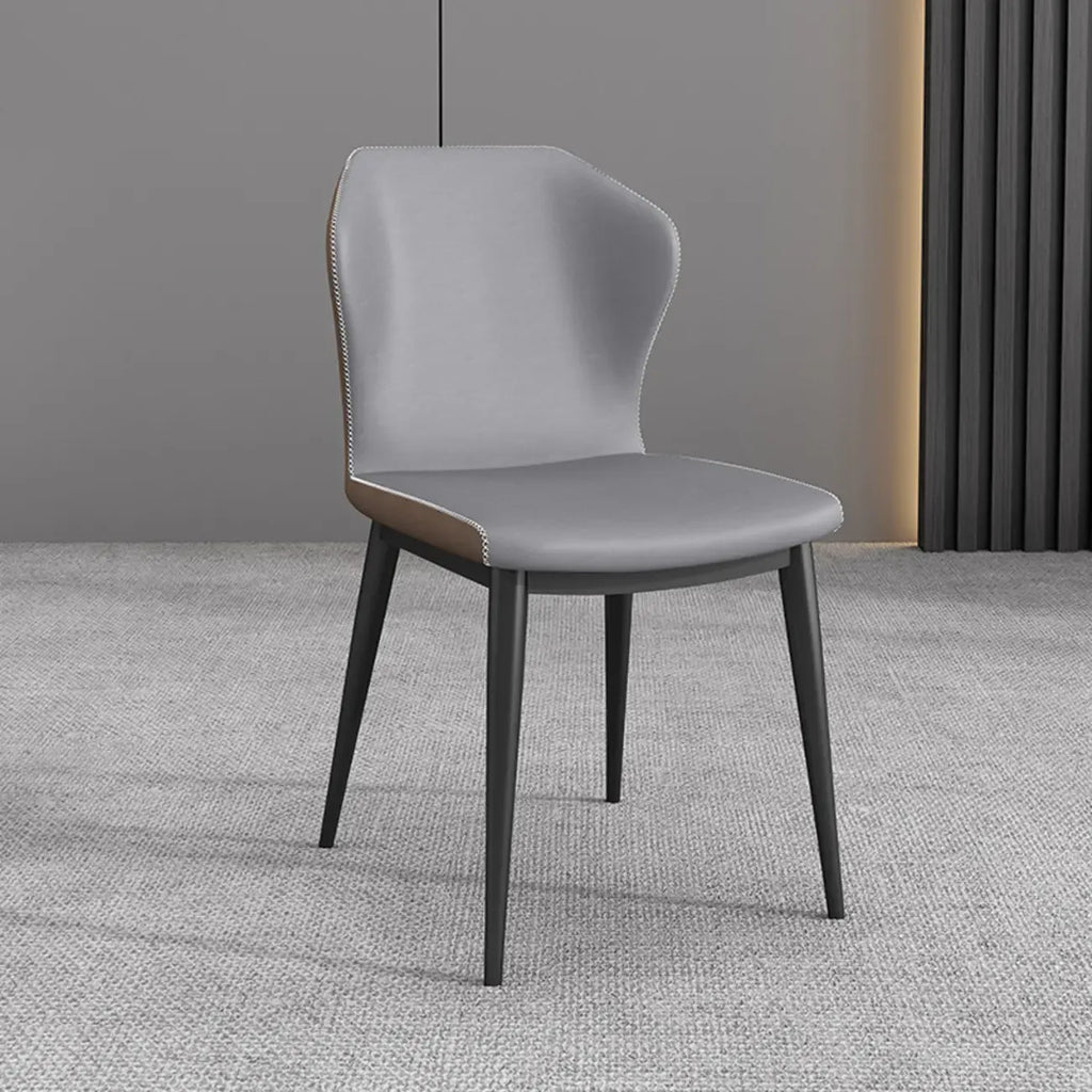 Chaise de salle à manger moderne en similicuir avec dossier à oreilles et pieds en acier