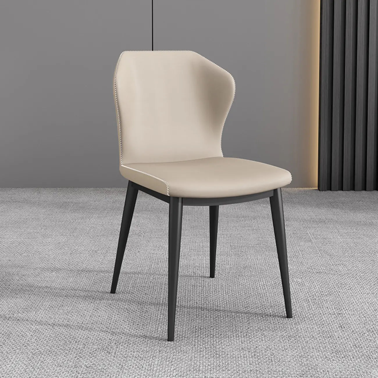 Chaise de salle à manger moderne en similicuir avec dossier à oreilles et pieds en acier