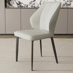 Chaise de salle à manger moderne à oreilles, revêtue de similicuir et dotée de pieds en métal