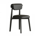 Chaise de salle à manger élégante à dossier bas, revêtue de similicuir.