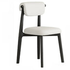 Chaise de salle à manger élégante à dossier bas, revêtue de similicuir.