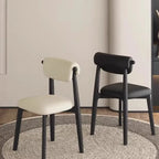 Chaise de salle à manger élégante à dossier bas, revêtue de similicuir.