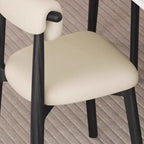 Chaise de salle à manger élégante à dossier bas, revêtue de similicuir.