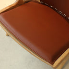 Fauteuil minimaliste en cuir marron selle pour salon