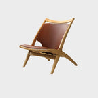 Fauteuil minimaliste en cuir marron selle pour salon