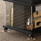 Table basse roulante noire avec plateau relevable et rangement pour salon
