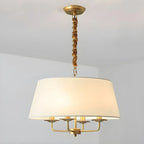 Lustre moderne chic en métal doré, structure tambour.