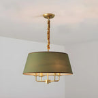 Lustre moderne chic en métal doré, structure tambour.