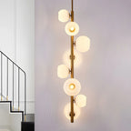Lampadario verticale a 8 luci moderno in ottone con aste a discesa multidirezionali