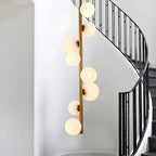 Lampadario verticale a 8 luci moderno in ottone con aste a discesa multidirezionali