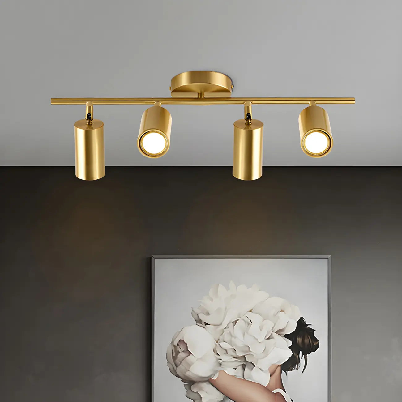 Faretto su binario a 4 luci color oro chiaro con teste regolabili