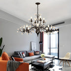 Lampadario a candelabro moderno ed elegante con rami neri e cristalli