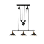 Suspension industrielle en métal noir avec poulie pour cuisine
