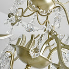 Lustre élégant en métal courbé et cristal doré