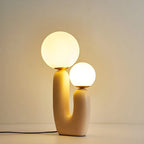 Lampe de table en verre globe cactus en résine rose