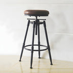 Tabourets de bar pivotants en métal et cuir de style industriel avec dossier