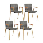 Chaise de salle à manger en cuir avec pieds en métal, accoudoirs et dossier.