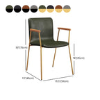 Chaise de salle à manger en cuir avec pieds en métal, accoudoirs et dossier.