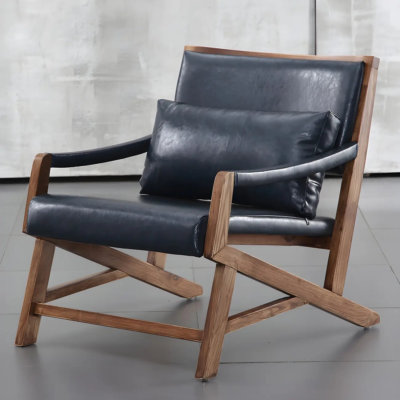 Fauteuil lounge moderne en similicuir avec dossier coussin