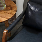 Fauteuil lounge moderne en similicuir avec dossier coussin