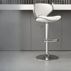 Tabouret de bar pivotant et réglable avec selle rembourrée en cuir