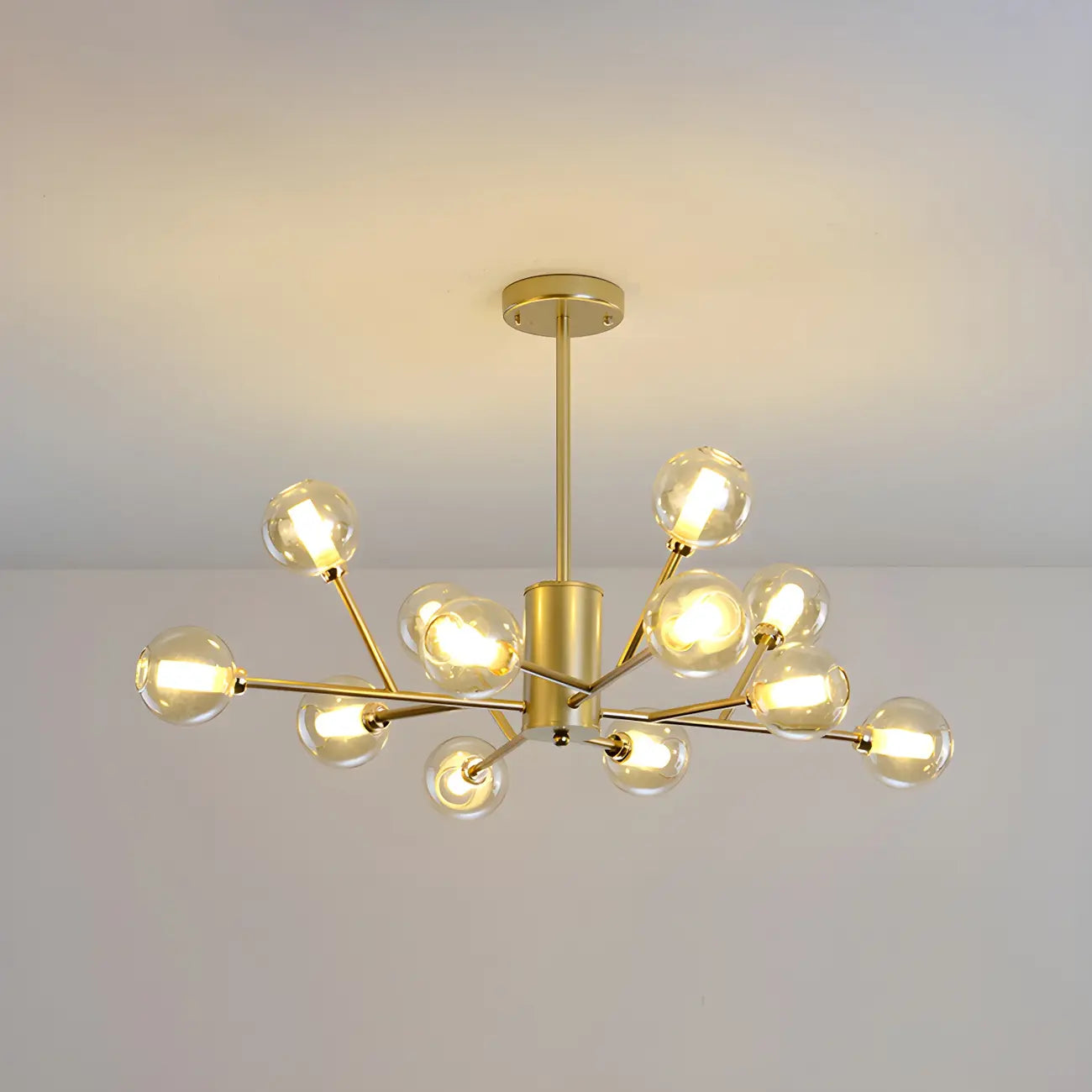 Lustre Sputnik moderne en métal doré et globe en verre