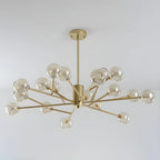 Lustre Sputnik moderne en métal doré et globe en verre