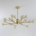 Lustre Sputnik moderne en métal doré et globe en verre