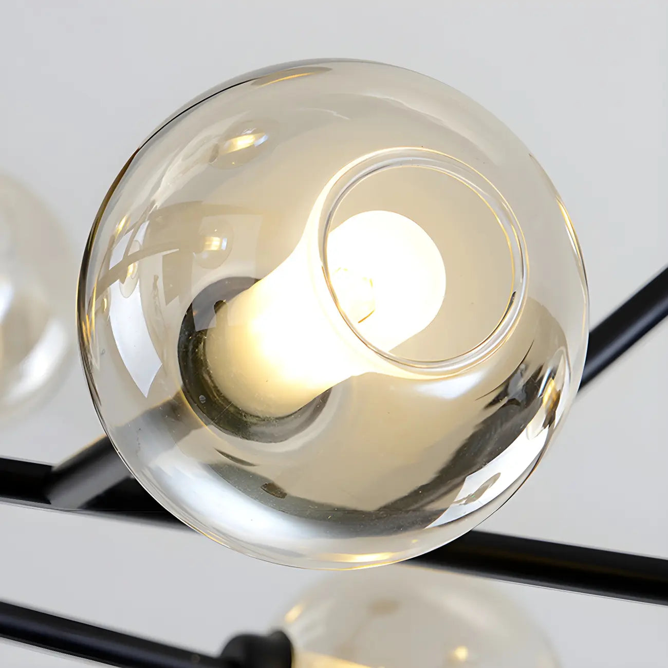 Lustre Sputnik moderne en métal doré et globe en verre