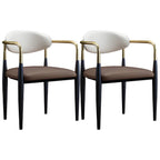 Chaise de salle à manger avec pieds en métal courbés et accoudoirs en similicuir.