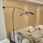 Lampadaire arqué en métal noir artistique de 73 pouces avec bras oscillant