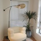 Lampadaire arqué en métal noir artistique de 73 pouces avec bras oscillant