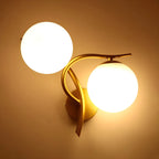 Applique murale double en verre torsadé doré moderne avec globe lumineux