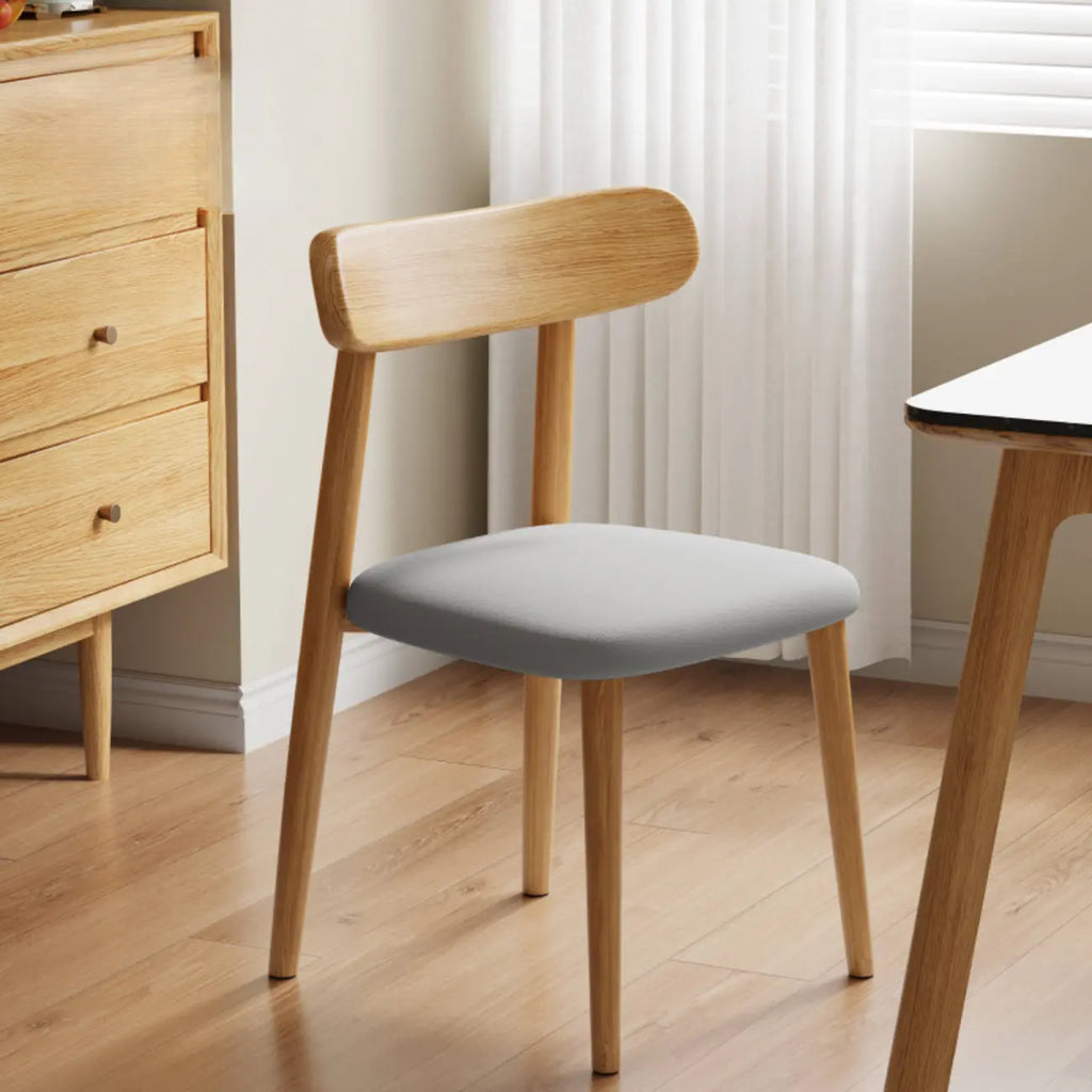 Chaise de salle à manger moderne en cuir sans accoudoirs et dossier bas