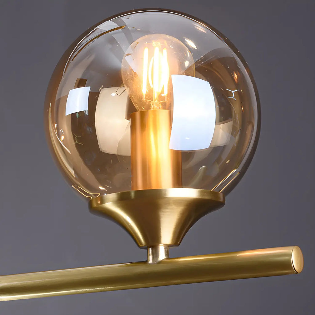 Îlot de cuisine moderne avec lustre globe en verre doré