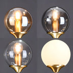 Îlot de cuisine moderne avec lustre globe en verre doré
