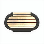 Poteau lumineux extérieur en métal en forme de tambour avec capuchon de protection pour grille.
