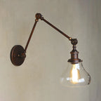 Applique murale rustique en métal avec bras articulé et abat-jour en verre transparent en forme de poire