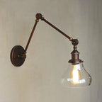 Applique murale rustique en métal avec bras articulé et abat-jour en verre transparent en forme de poire