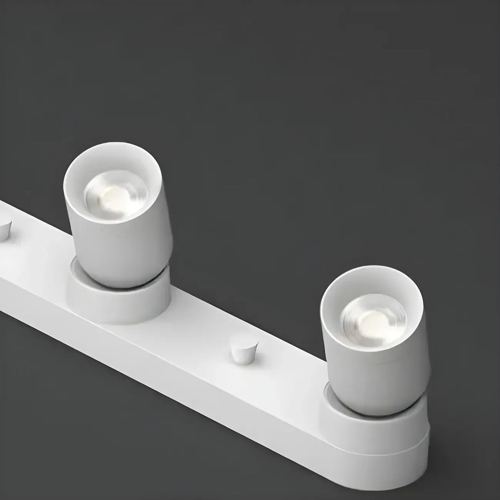 Mini projecteur LED encastré réglable en aluminium, style minimaliste.